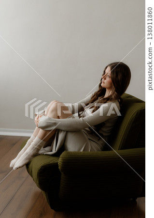 Peaceful Knitter Relaxing. Gentle Lady Enjoying Sunlight While Carefully Knitting Attire Peaceful Knitter Relaxing. Gentle Lady Enjoying Sunlight While Carefully Knitting Attire 138011860