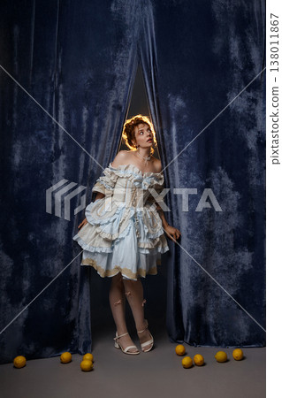 Vintage Woman Peering. Woman Peeks From Backstage Area. Curious Woman Steps Into Faint Illumination 138011867