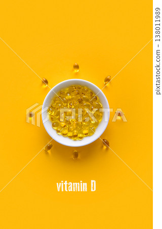 Soft gels vitamin D (cholecalciferol) capsules in white bowl Soft gels vitamin D (cholecalciferol) capsules in white bowl 138011989