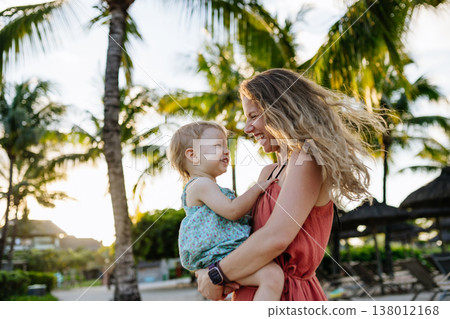 Mother with little daughter in tropical beach resort. Mother with little daughter in tropical beach resort. 138012168