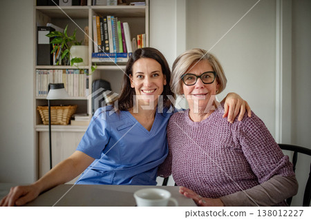 Portrait of physiotherapist and senior woman during rehabilitation exercise. 138012227