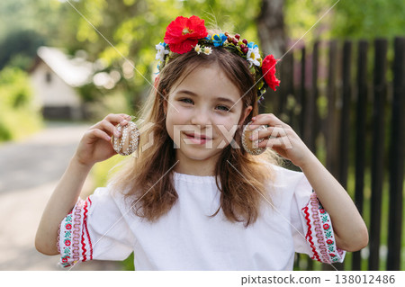 Girl holding handmade Easter eggs decorated with traditional folk techniques in Slovakia. Girl holding handmade Easter eggs decorated with traditional folk techniques in Slovakia. 138012486