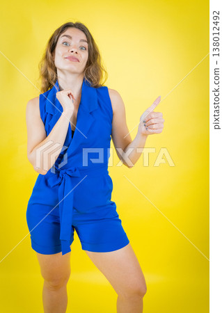 Young woman showing approval with thumbs up Young woman showing approval with thumbs up 138012492