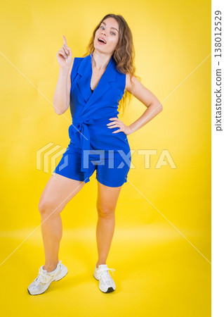 Young woman pointing empty space for idea 138012529