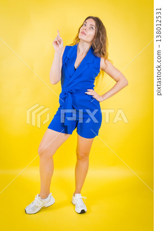 Woman pointing up showing idea or direction 138012531