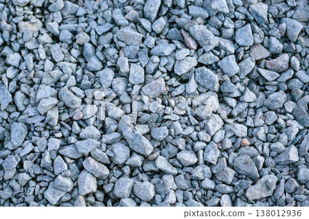 Crushed grey stone texture with various sizes of sharp-edged granite rocks. Crushed grey stone texture with various sizes of sharp-edged granite rocks. 138012936