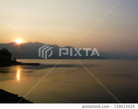 beautiful landscape of mountains on the sea coast at sunset beautiful landscape of mountains on the sea coast at sunset 138013024