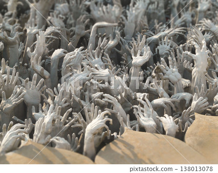 Sculptures of reaching hands from hell at Wat Rong Khun White Temple in Chiang Rai 138013078