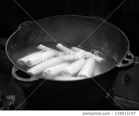 Yellow corn is cooked in a large cauldron Yellow corn is cooked in a large cauldron 138013197
