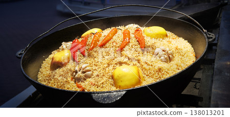 Aromatic pilaf is fried in a cauldron 138013201