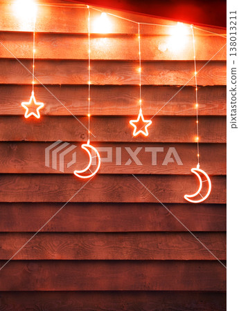 Bright glowing Xmas decoration. Stars and moon Bright glowing Xmas decoration. Stars and moon 138013211