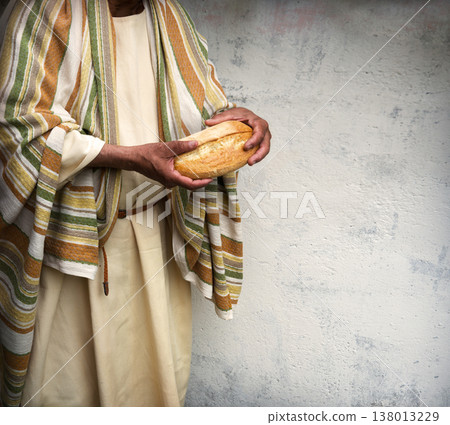 Man's hans holding fresh bread Man's hans holding fresh bread 138013229