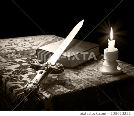Iron sword on old bible 138013231