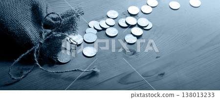 Silver coins in the bag 138013233