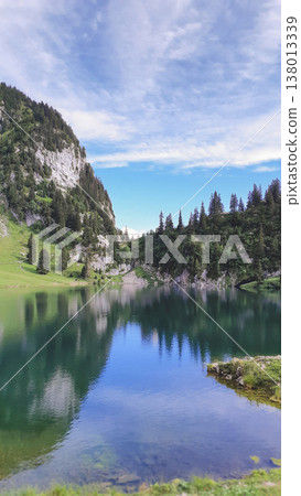 Pristine reflection of Lake Hinterstockensee in the Swiss Alps near Stockhorn 138013339