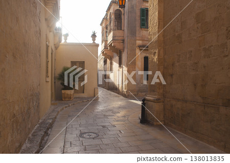 Narrow limestone street in the historic silent city of Mdina Malta 138013835