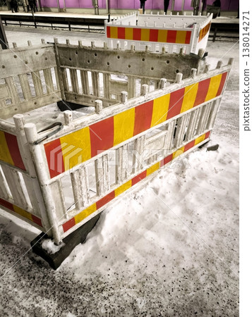 A temporary road barrier on a snow-covered station platform A temporary road barrier on a snow-covered station platform 138014271