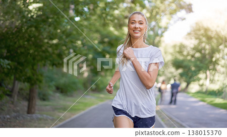 Woman running asphalt road summer park 138015370