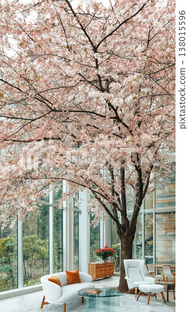 A visual depicting a living space harmoniously integrated with cherry blossoms in full bloom visible through large windows, representing a peaceful life bathed in natural light. A visual depicting a living space harmoniously integrated with cherry blossoms in full bloom visible through large windows, representing a peaceful life bathed in natural light. 138015596