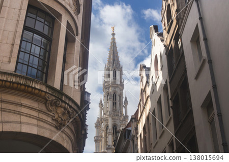 View of the gothic tower of the Brussels Town Hall from a narrow street 138015694