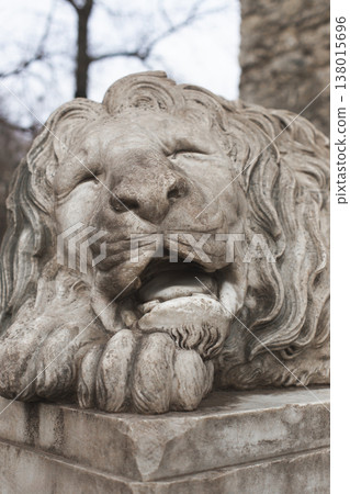 Sleeping marble lion near the Powder Tower in Lviv Sleeping marble lion near the Powder Tower in Lviv 138015696