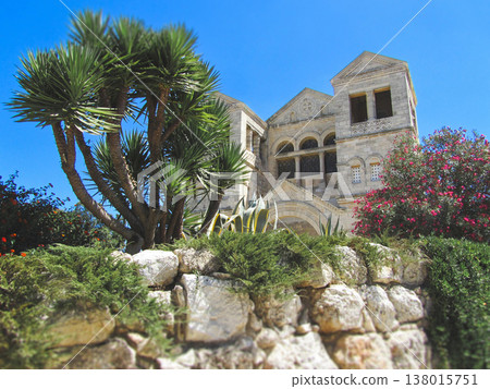 Facade of the Basilica of the Transfiguration on Mount Tabor through lush greenery Facade of the Basilica of the Transfiguration on Mount Tabor through lush greenery 138015751