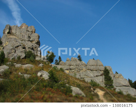 Massive rock formations of Tustan fortress under a clear blue sky Massive rock formations of Tustan fortress under a clear blue sky 138016175