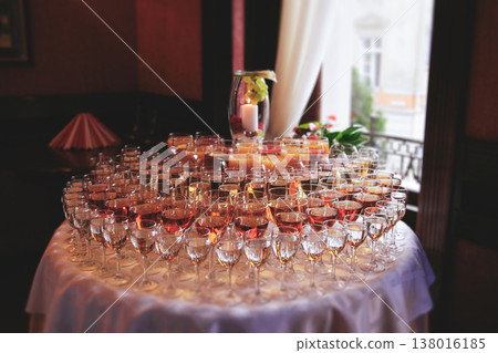 Close up of glass rows with wine and juice on a reception table 138016185