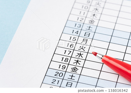 Close-up of a calendar and a red pen Close-up of a calendar and a red pen 138016342