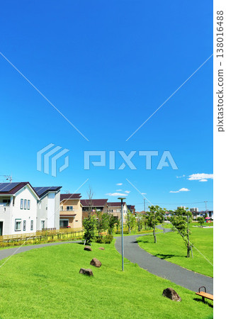 A cityscape and park scenery under a blue sky 138016488