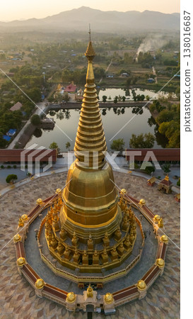 Beautiful aerial view of Phra Mahathat Chedi Sri Wiang Chai one of the biggest pagoda in Thailand, with the base of about 1,600 square metres located in Li district, Lamphun province. 138016687