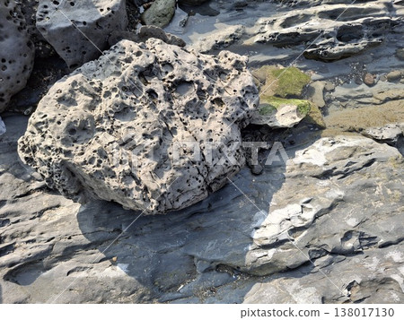Natural Coastal Rock Formations with Textured and Weathered Boulders by the Shore Natural Coastal Rock Formations with Textured and Weathered Boulders by the Shore 138017130