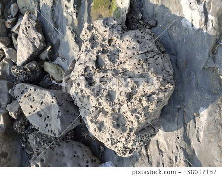 Natural Coastal Rock Formations with Textured and Weathered Boulders by the Shore- Natural Coastal Rock Formations with Textured and Weathered Boulders by the Shore- 138017132