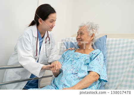 Asian doctor checking and treat elderly woman patient health in hospital. 138017478