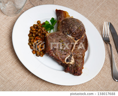 Fried veal with pegeon peas and parsley Fried veal with pegeon peas and parsley 138017688