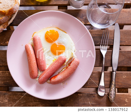 Healthy breakfast of scrambled eggs and sausages closeup Healthy breakfast of scrambled eggs and sausages closeup 138017912