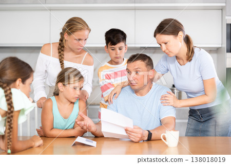 Big family reading upset letter Big family reading upset letter 138018019