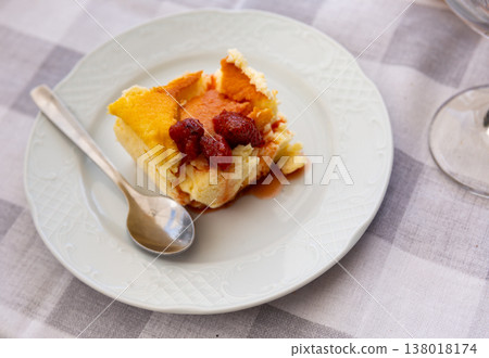 Piece of strawberry cheesecake served for dessert 138018174