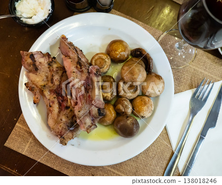 Jowl pork knuckle meat baked with mushroom caps. 138018246