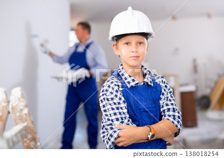 Preteen boy posing on indoor construction site 138018254