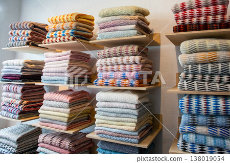 Colorful towel blankets lined up in a Scandinavian textile shop Colorful towel blankets lined up in a Scandinavian textile shop 138019054