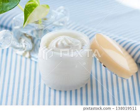 Opened cosmetic cream Opened cosmetic cream 138019511