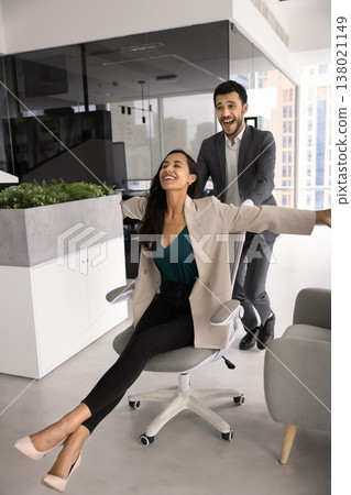 Two happy workmates having fun in coworking office Two happy workmates having fun in coworking office 138021149