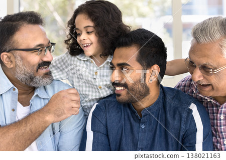 Multigenerational Indian family engaging in joyful and affectionate interaction 138021163