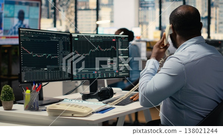Worried portfolio managers making telephone calls in response to Black Swan event disruption. Panicked prop firm workers evaluate stock market impact of unexpected recession Worried portfolio managers making telephone calls in response to Black Swan event disruption. Panicked prop firm workers evaluate stock market impact of unexpected recession 138021244