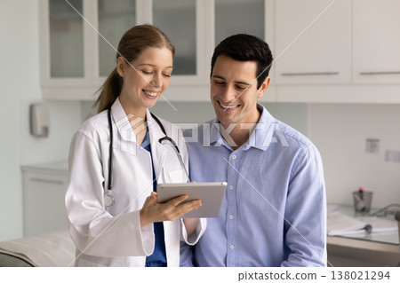 Patient smiling while therapist sharing good health news Patient smiling while therapist sharing good health news 138021294