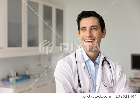 Doctor looks into distance with optimistic expression 138021404