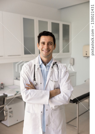 Portrait of happy man general practitioner in white coat Portrait of happy man general practitioner in white coat 138021431