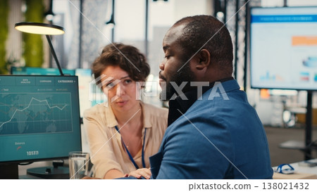 Exasperated black manager dealing with a stressful situation at the office, worried stressed woman colleague trying to calm him down and showing empathy. Trying to avoid a bigger crisis. Camera B. Exasperated black manager dealing with a stressful situation at the office, worried stressed woman colleague trying to calm him down and showing empathy. Trying to avoid a bigger crisis. Camera B. 138021432