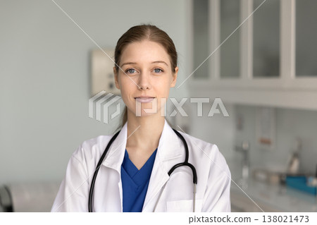 Head shot close-up portrait of happy woman nurse or intern Head shot close-up portrait of happy woman nurse or intern 138021473